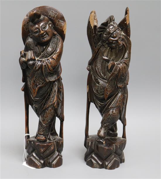Two 19th century carved wooden Chinese figures inlaid with silver (2) tallest measures 35cm